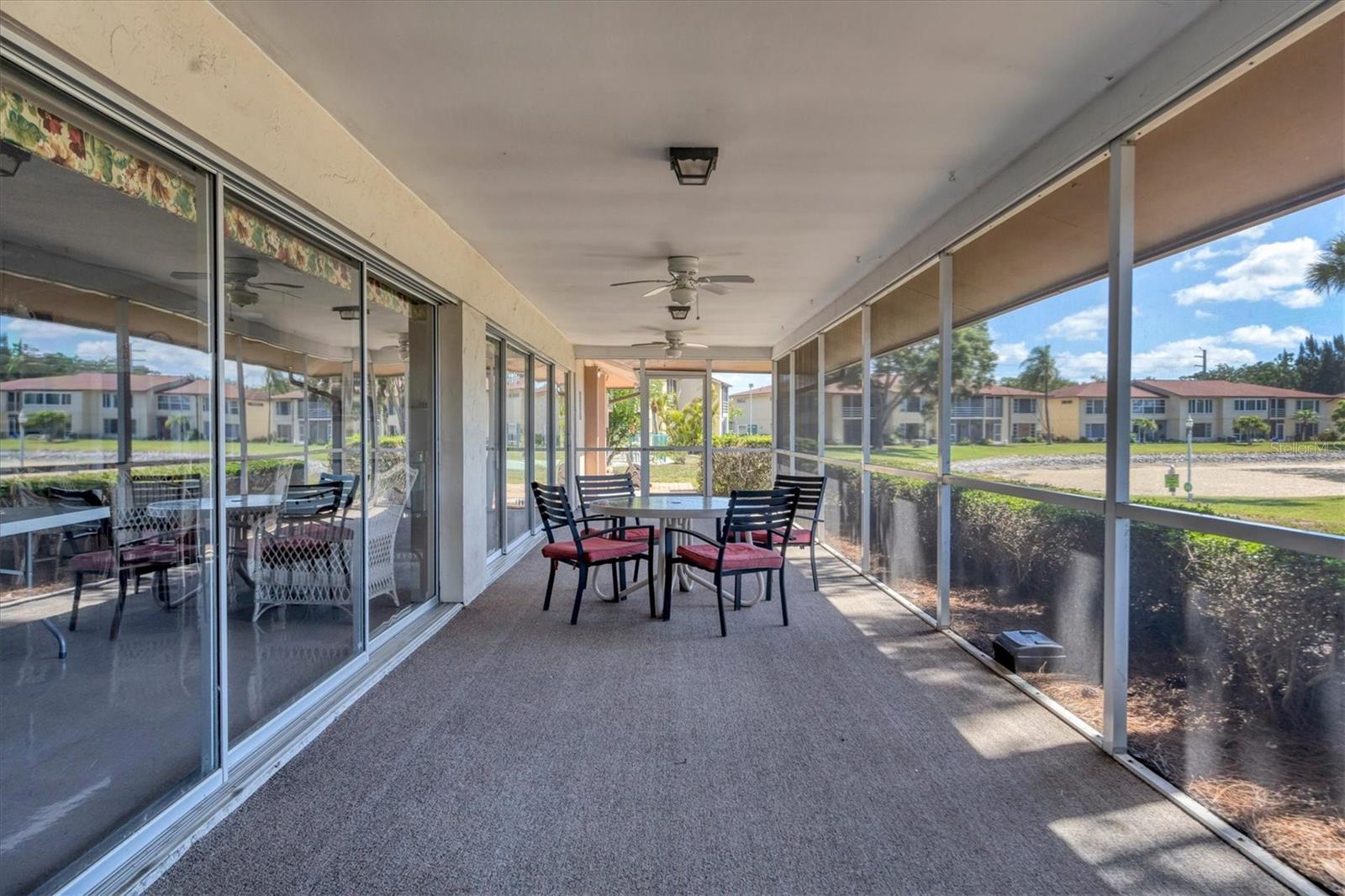 Clubhouse covered lanai overlooks large lake