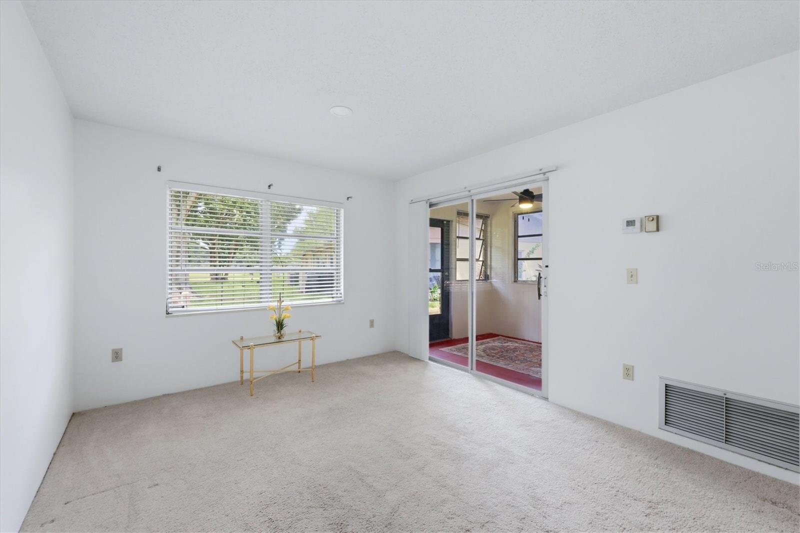 Living room area opens to covered porch