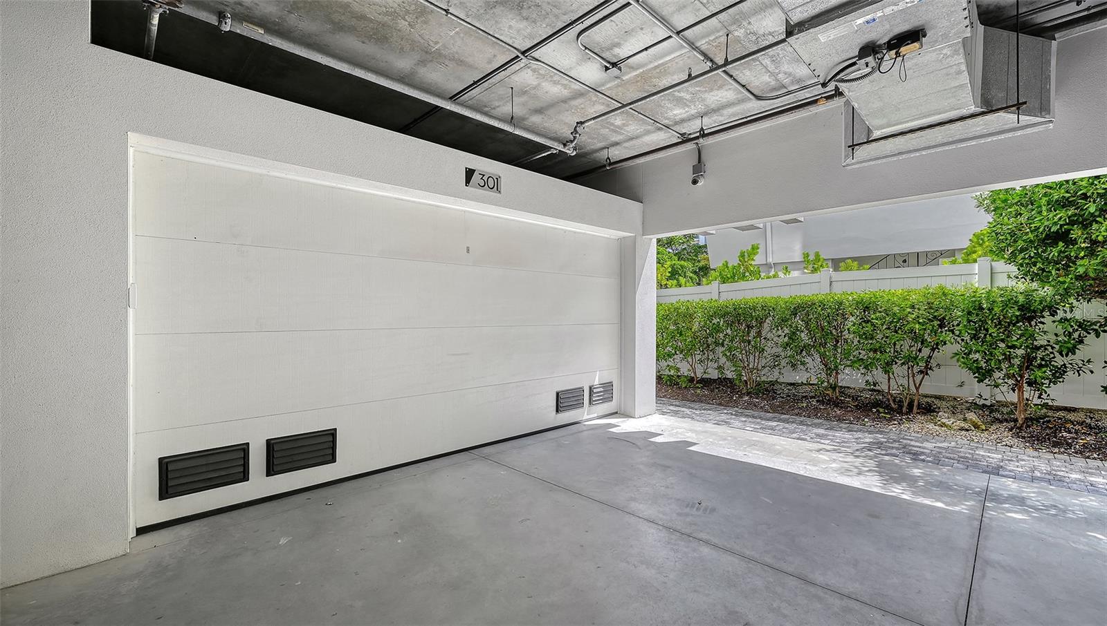 Under building 2 car garage for unit 301
