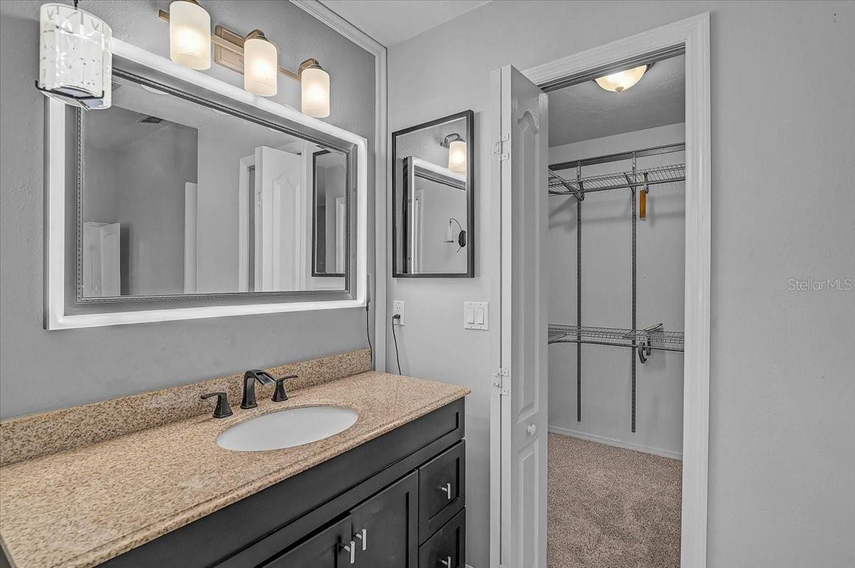 Smart mirror custom color light frame in primary bathroom and Walkin Closet.