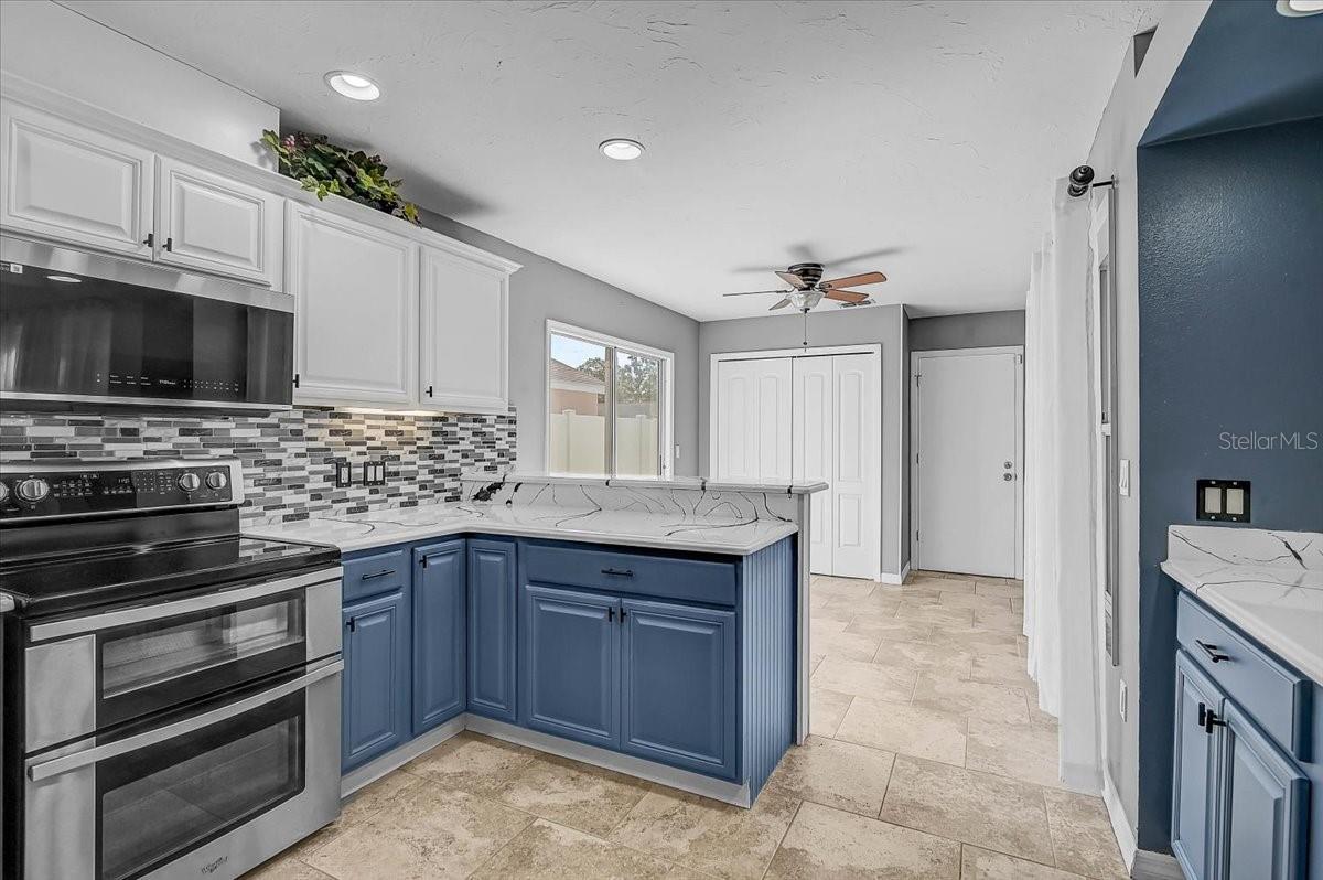 Kitchen Looking into Dinette and Sliding Glass Doors to Side Patio,
