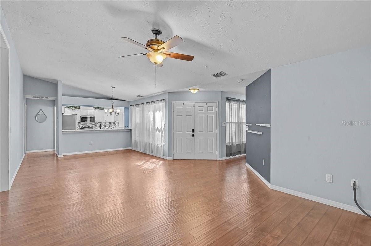 Living Room, Dining Room, Kitchen. Front Double Doors.