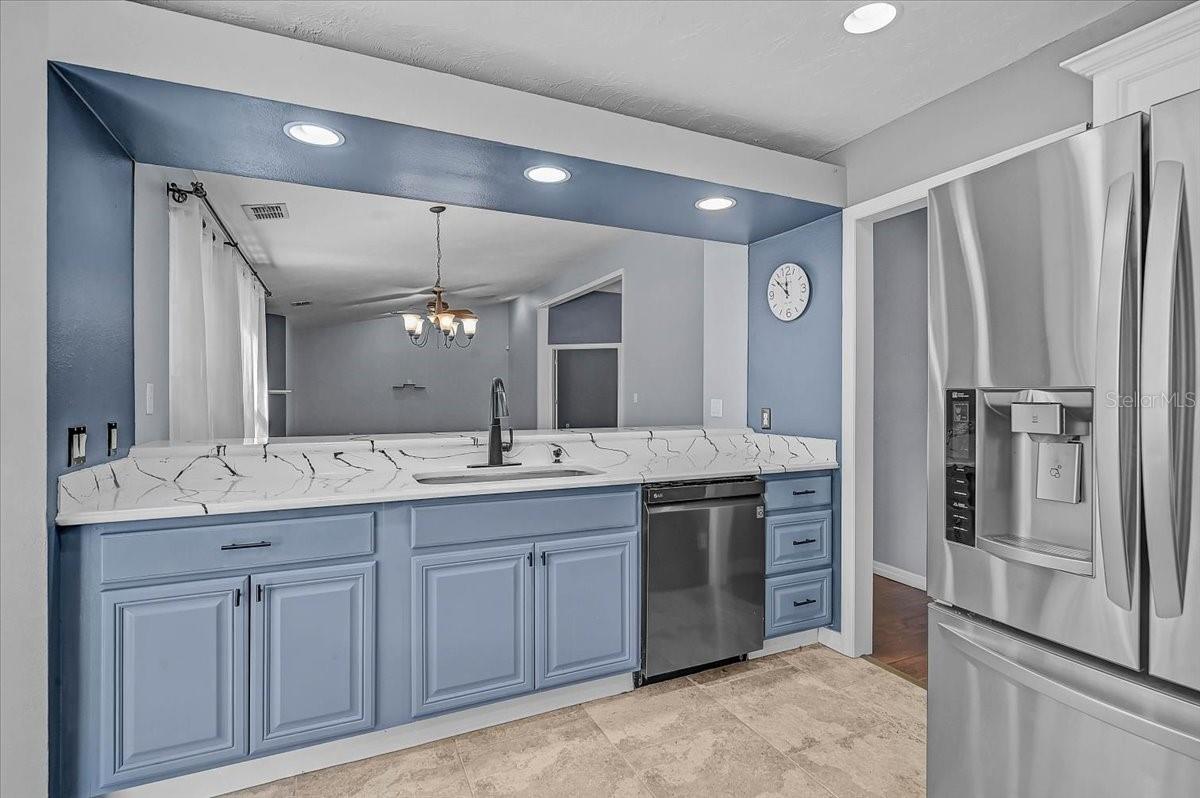 Kitchen Looking into Dining Room and Living Room.