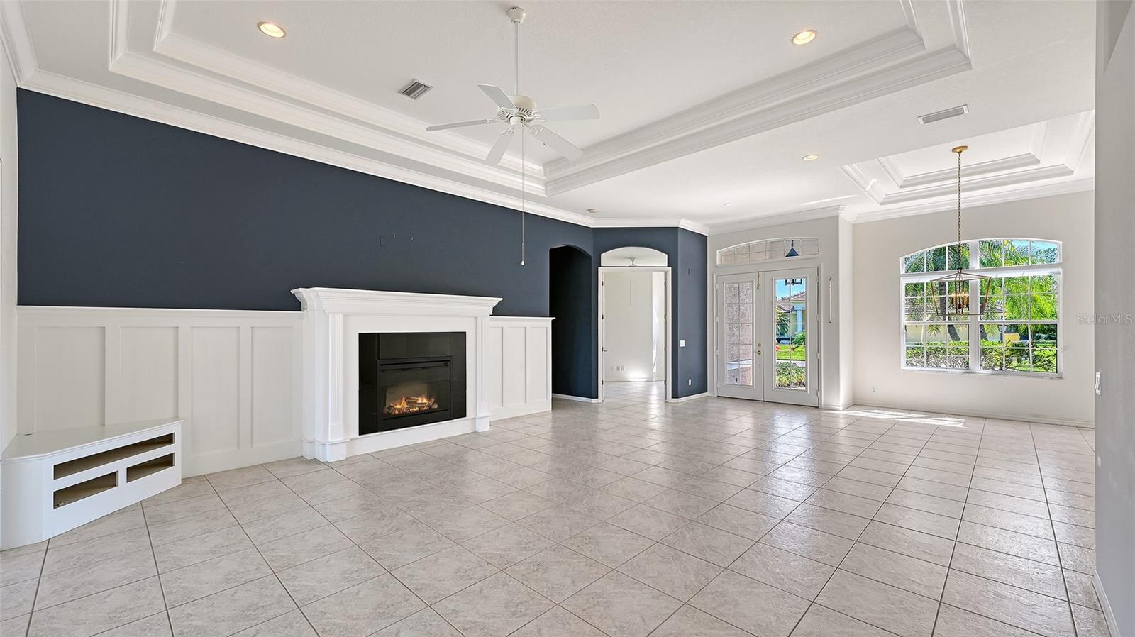 Triple tray ceilings and wood accents