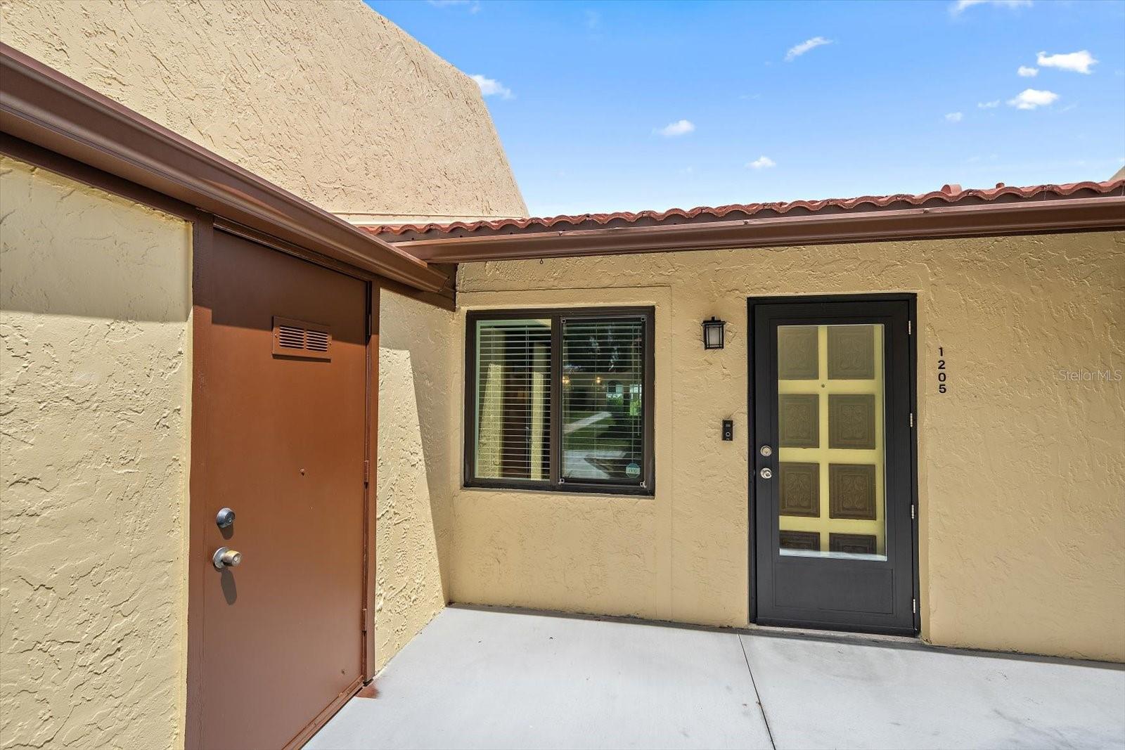 Front of home with exterior storage