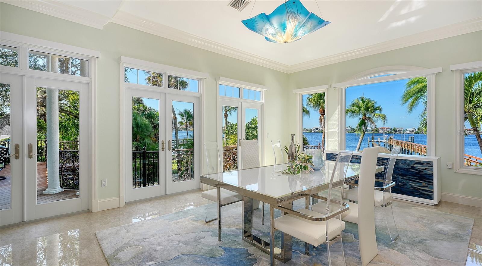 easy access to side catwalk that connects to 1st floor primary and covered outdoor living space with fireplace and outdoor kitichen