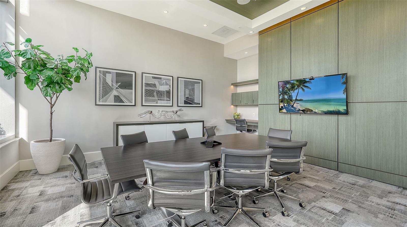 A well-appointed conference room with ample seating, ideal for important meetings, collaboration, and productive gatherings.