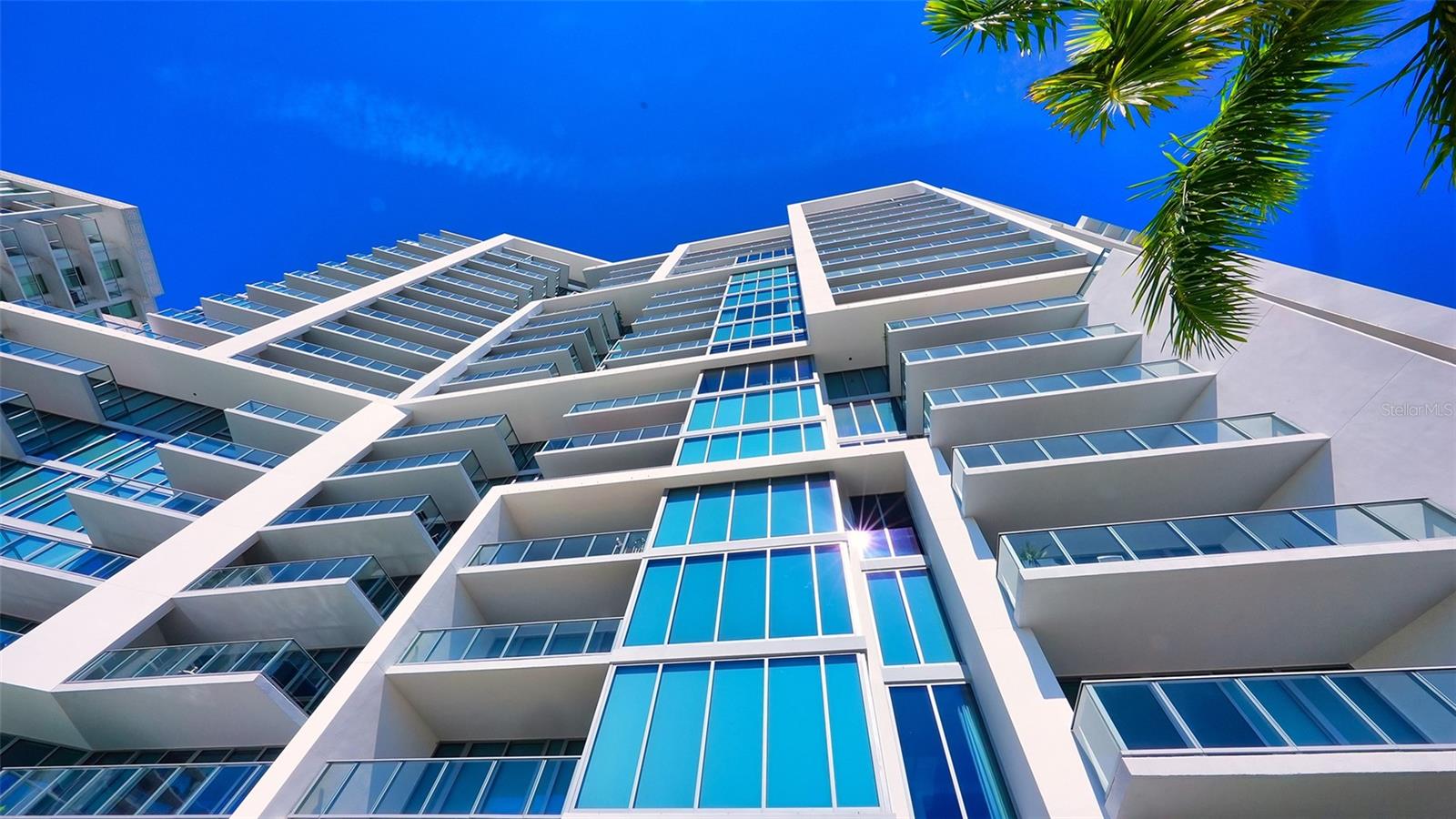 A striking upward perspective showcases The VUEs iconic architecture, highlighting its distinctive design, soaring height, and impressive modern lines.