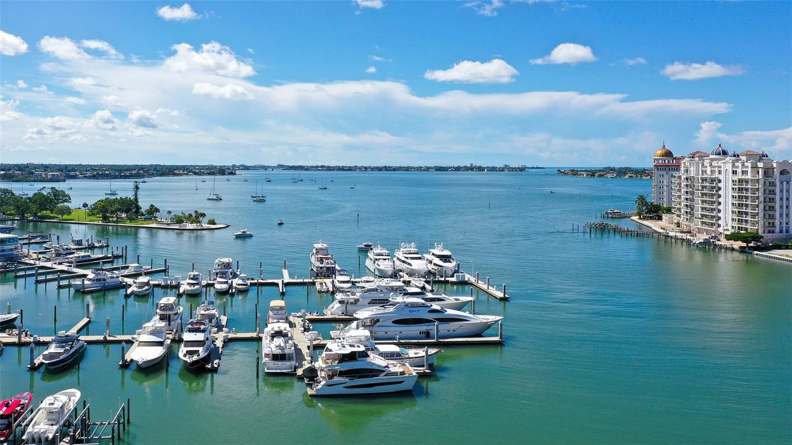 Enjoy captivating views of the marina and Sarasota Bay from this exceptional waterfront residence.