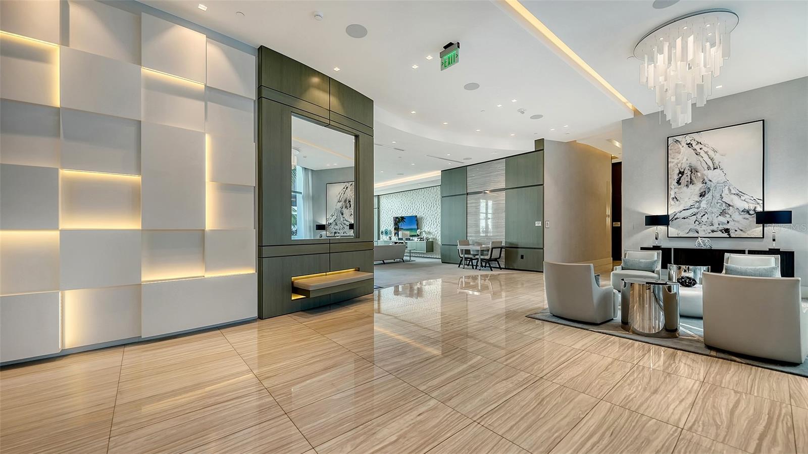 A grand, elegant entrance featuring refined seating areas, creating a warm and sophisticated welcome for residents and their guests.
