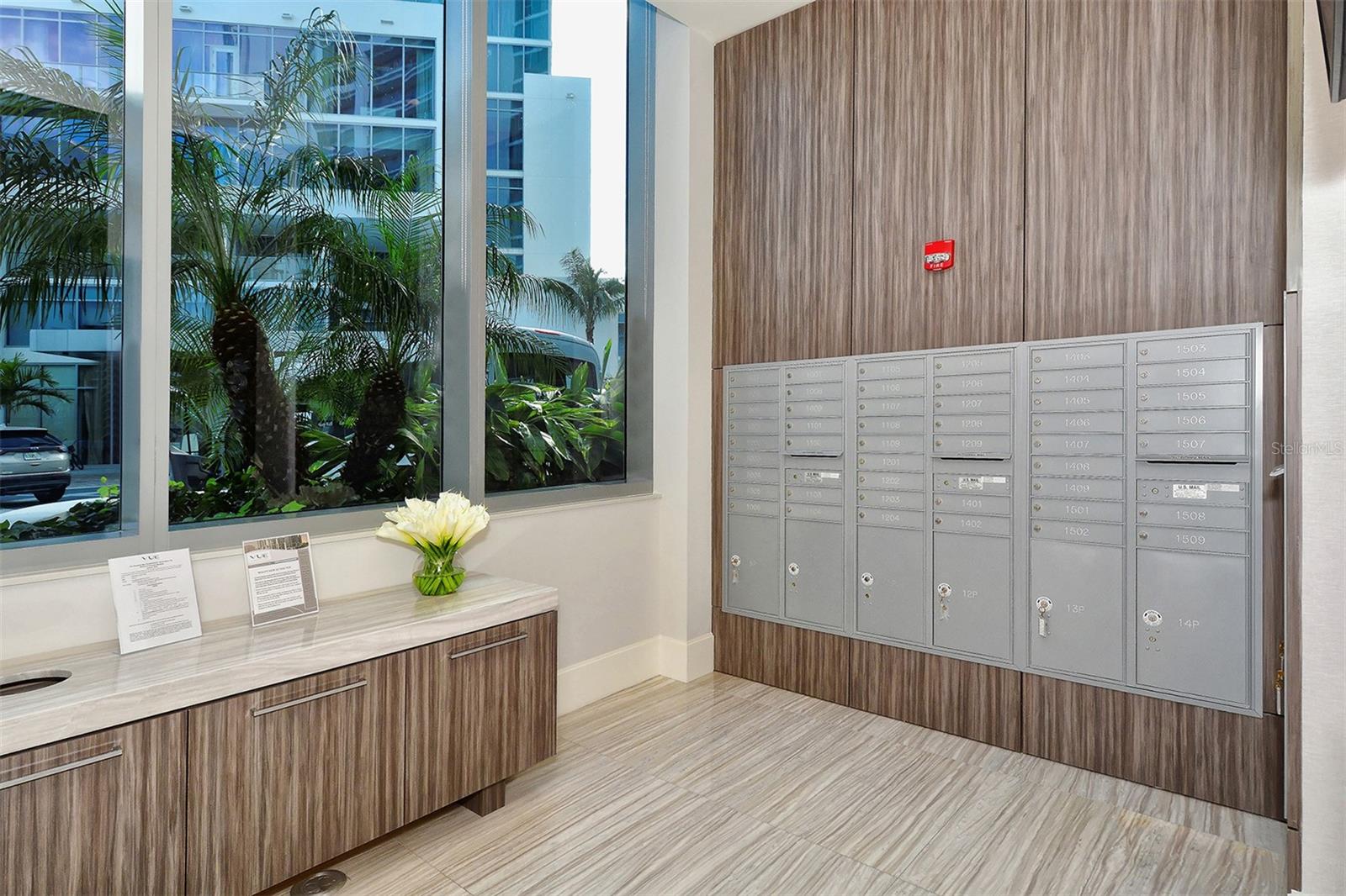 A dedicated resident mailbox area featuring a digital display with upcoming community events and announcements for added convenience.
