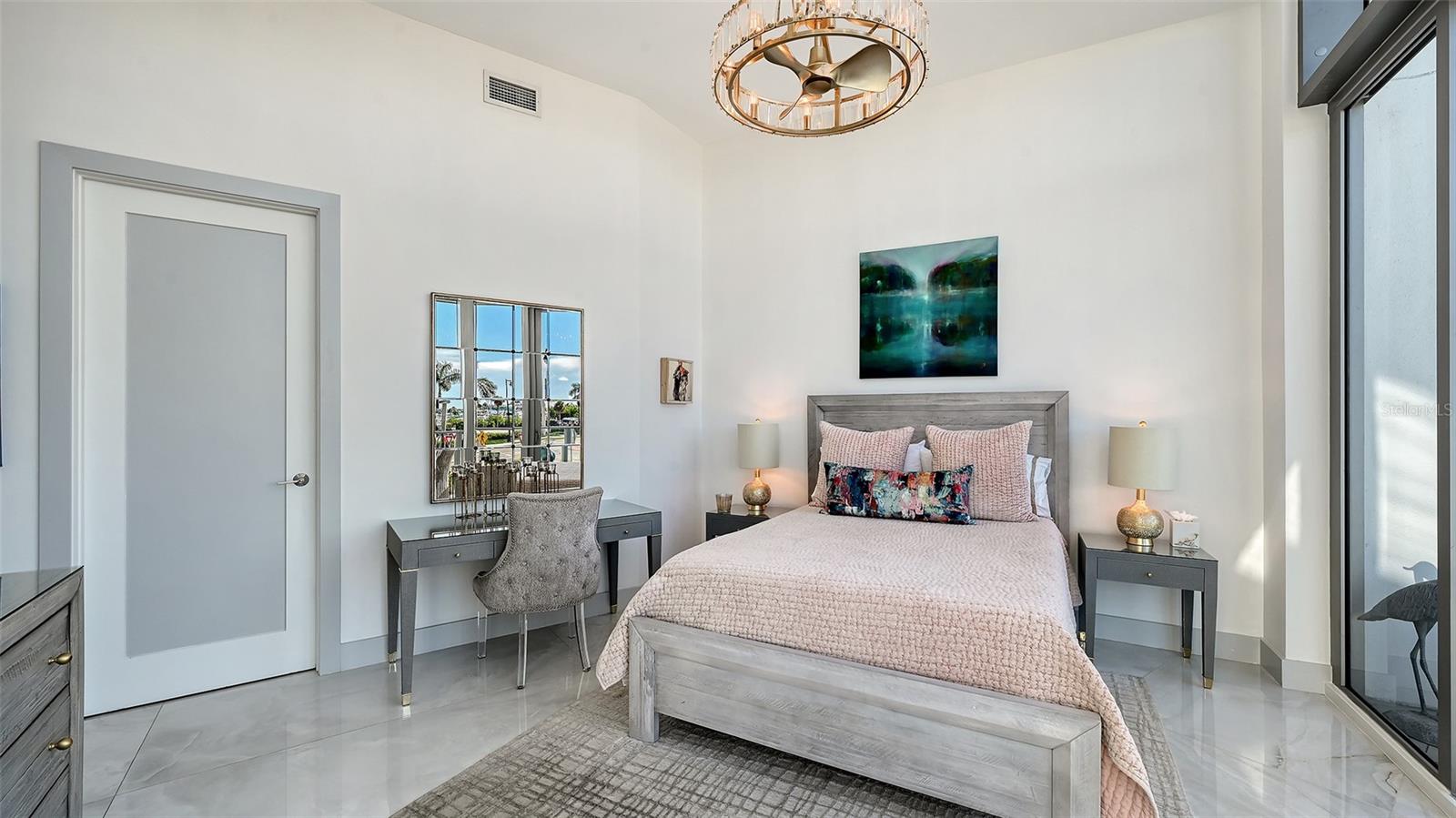 The primary suite offers a spacious design inspiring relaxation and comfort.