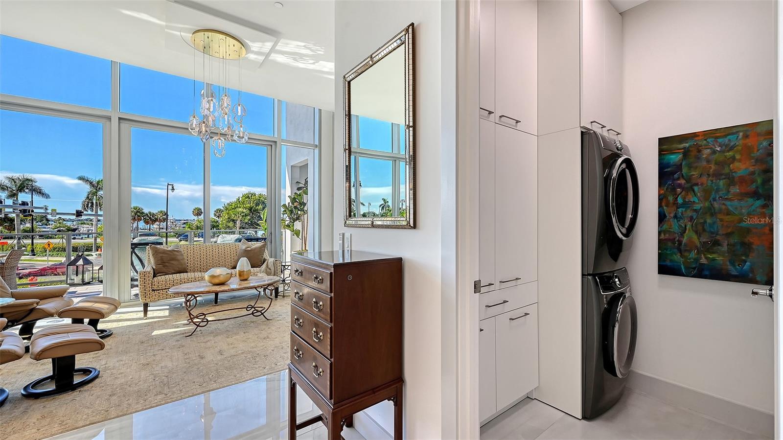 Custom-designed laundry room featuring a new, full-size LG WashTower and custom cabinetry for exceptional storage and organization.