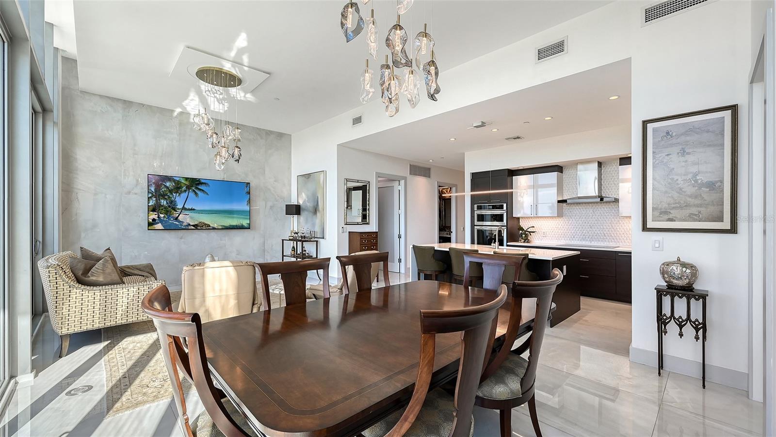 An inviting dining area seamlessly connected to the kitchen and living room, perfect for memorable meals, lively game nights, and effortless entertaining.