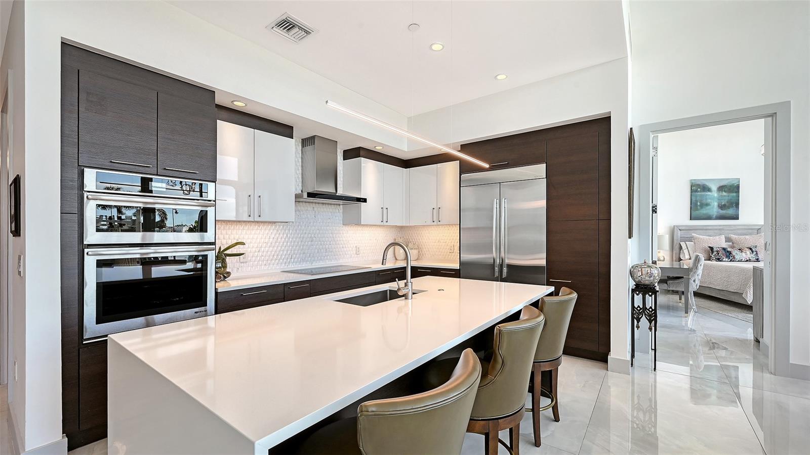 A beautifully appointed kitchen featuring top-of-the-line appliances, perfect for the culinary enthusiast and sophisticated entertaining