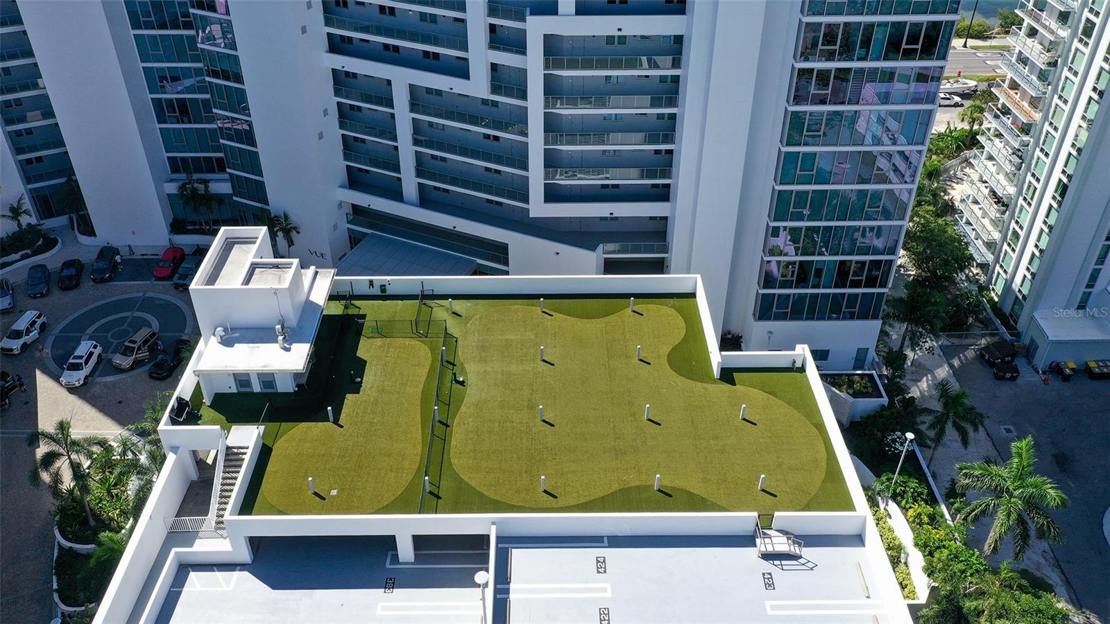 An expansive rooftop dog park offering ample space for running and playing.