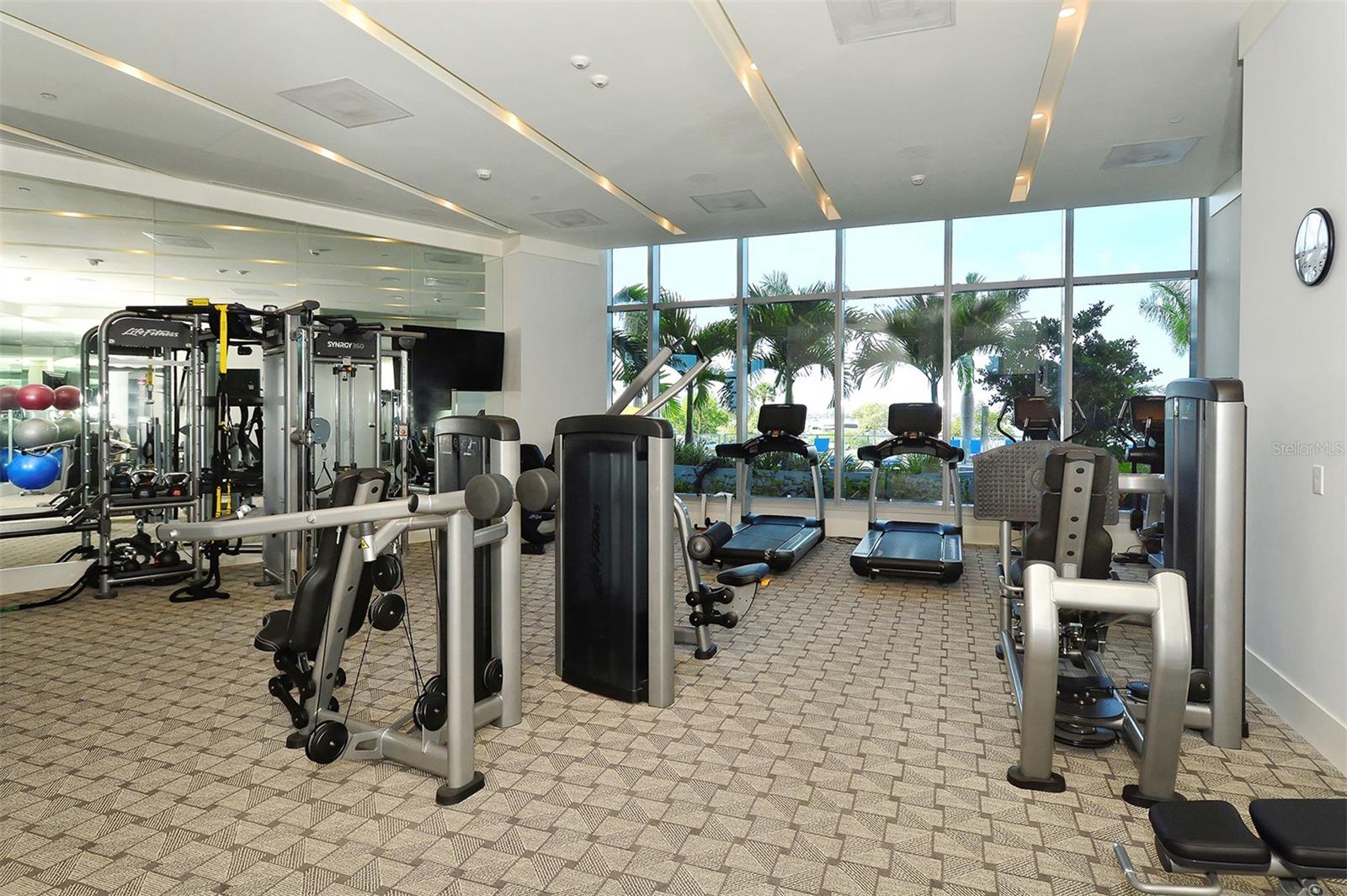 A premier fitness center designed to inspire, with state-of-the-art equipment and stunning pool and Sarasota Bay views that elevate every workout.