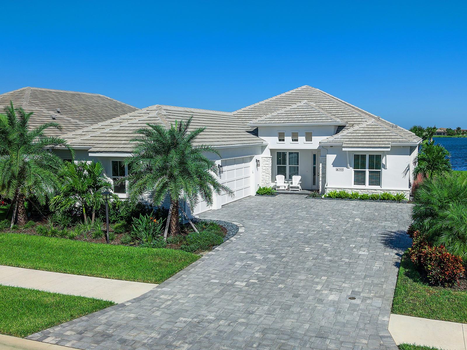 Large paver driveway with parking pad