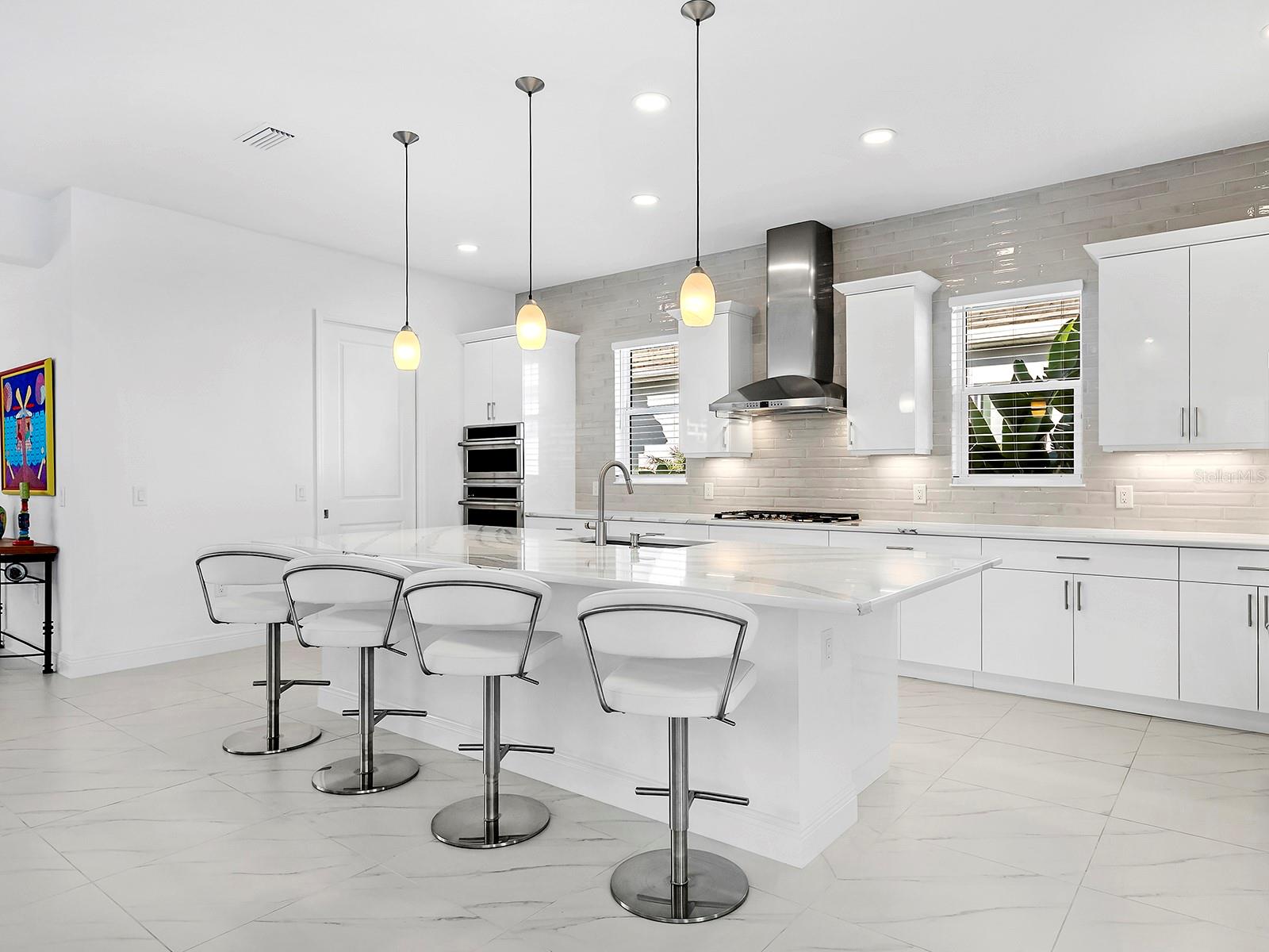 Counter-to-ceiling subway tile backsplash