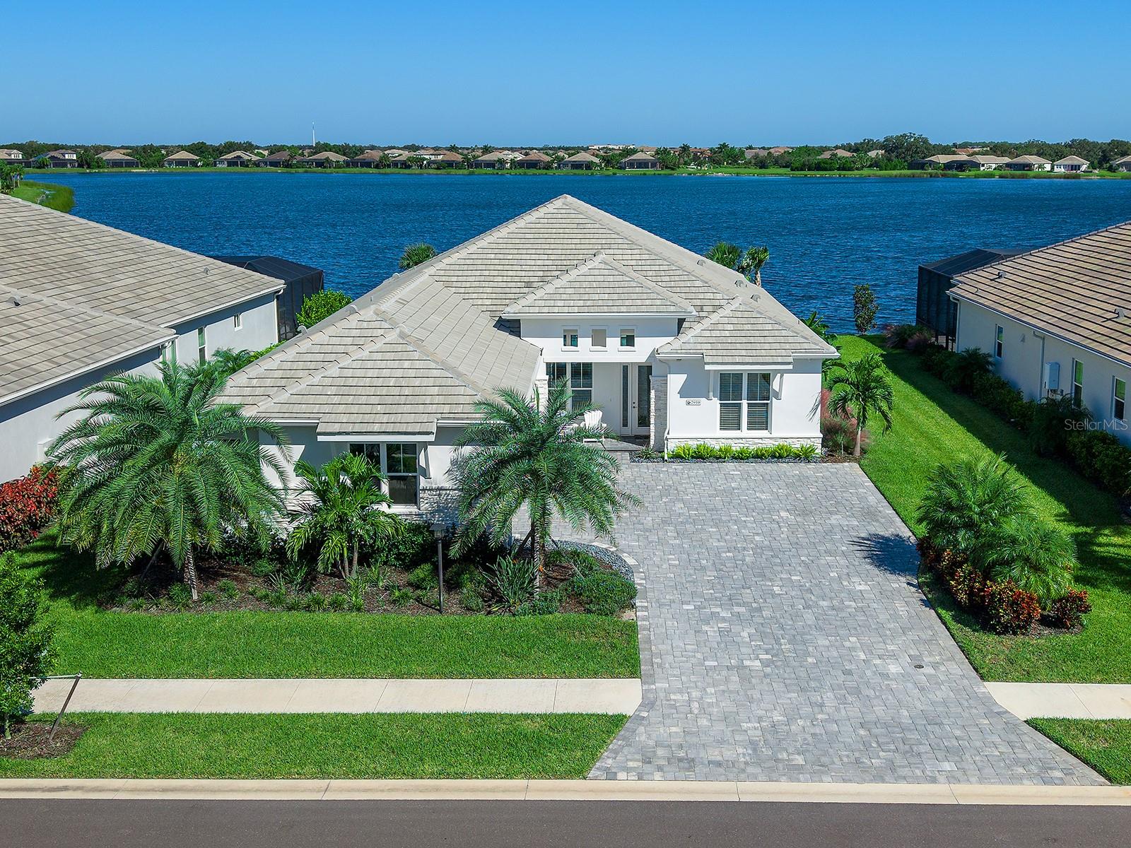 Meticulous landscaping with grounds maintenance in HOA fee