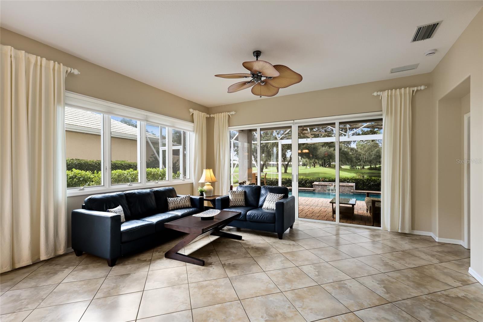 Spacious living room with views of the course