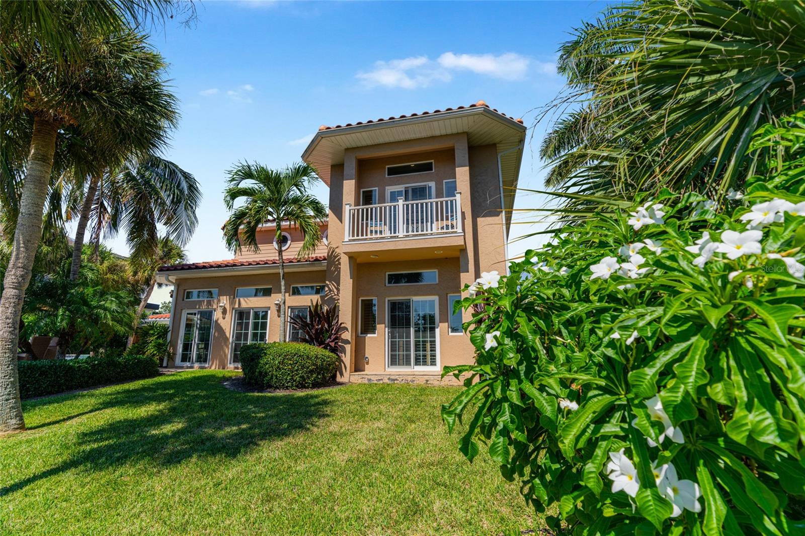 Rear Yard Waterfront, highlighting the connection to the water and Siesta Key lifestyle.