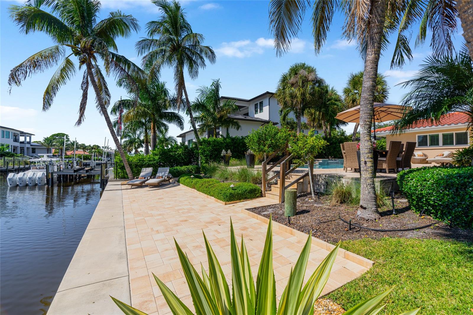 Canal Walkway View, highlighting the connection to the water and Siesta Key lifestyle.