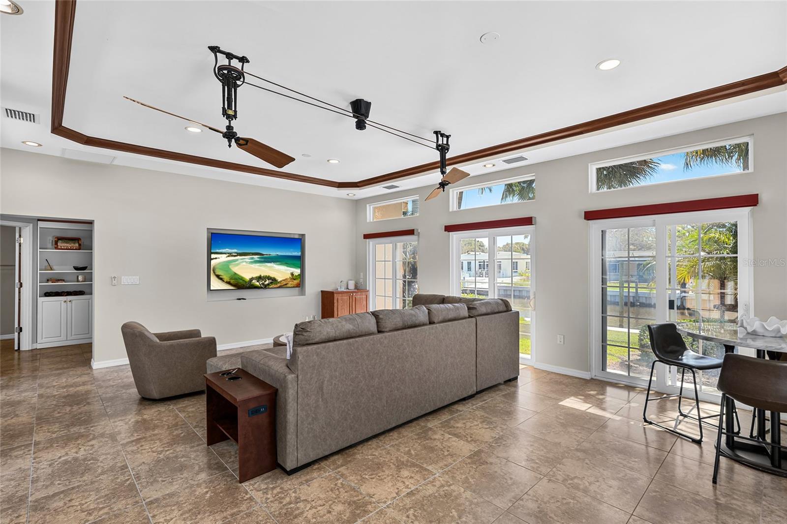 Rear view of the approximately 424 square foot flex room, offering space for a media room, gym, game room, lounge or other flexible use.