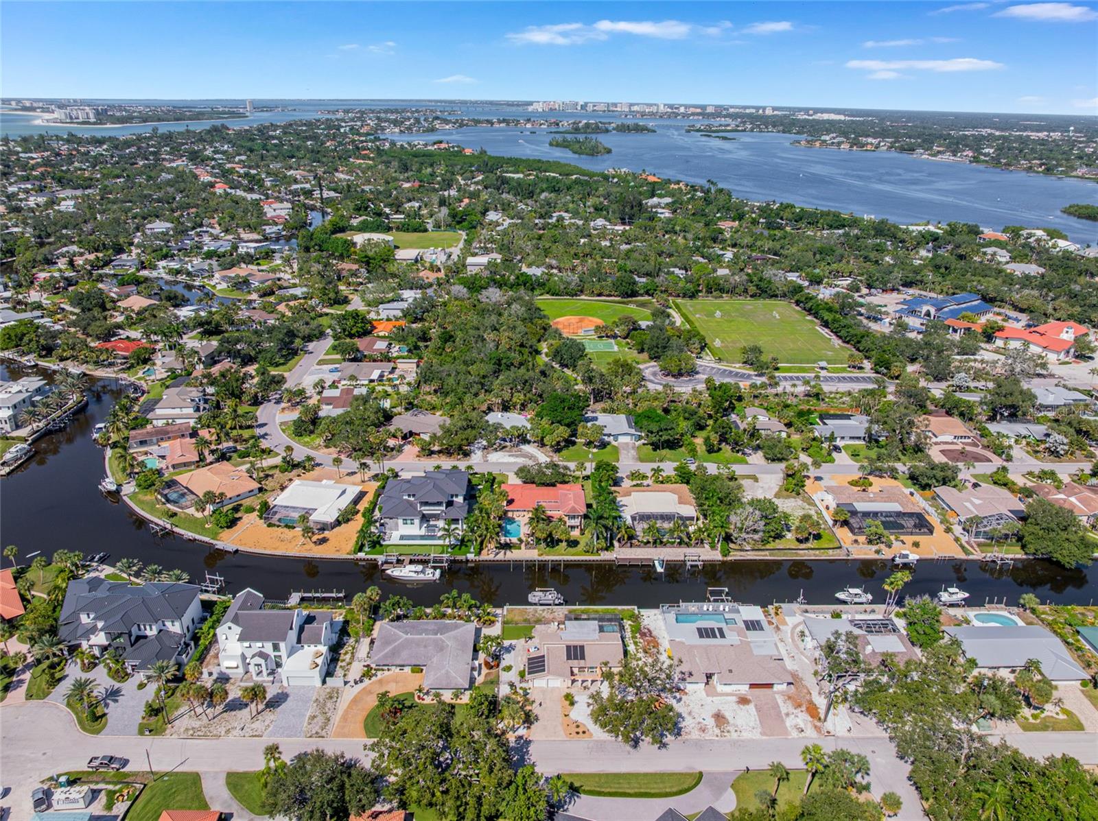 Wide aerial view showing the homes Siesta Key setting near the Gulf, beach and surrounding waterways