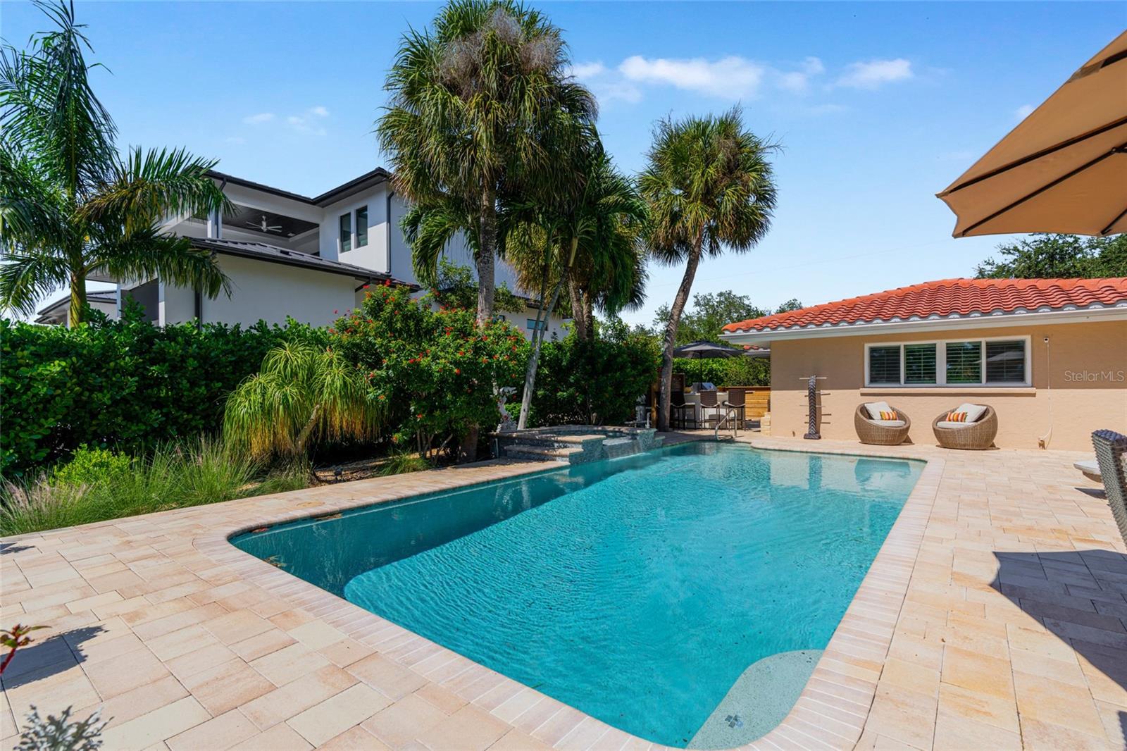Pool Rear Daytime, creating an inviting setting for relaxing and entertaining.