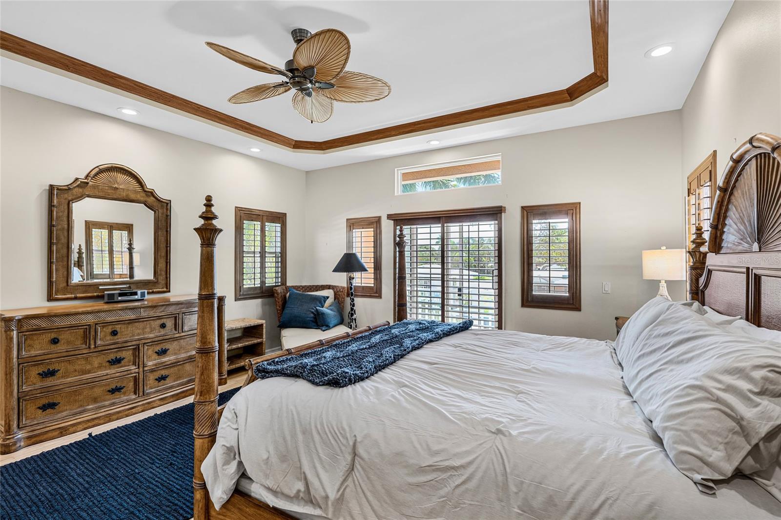 Wide view of the second floor primary suite, a private upper level retreat with canal views and balcony access.