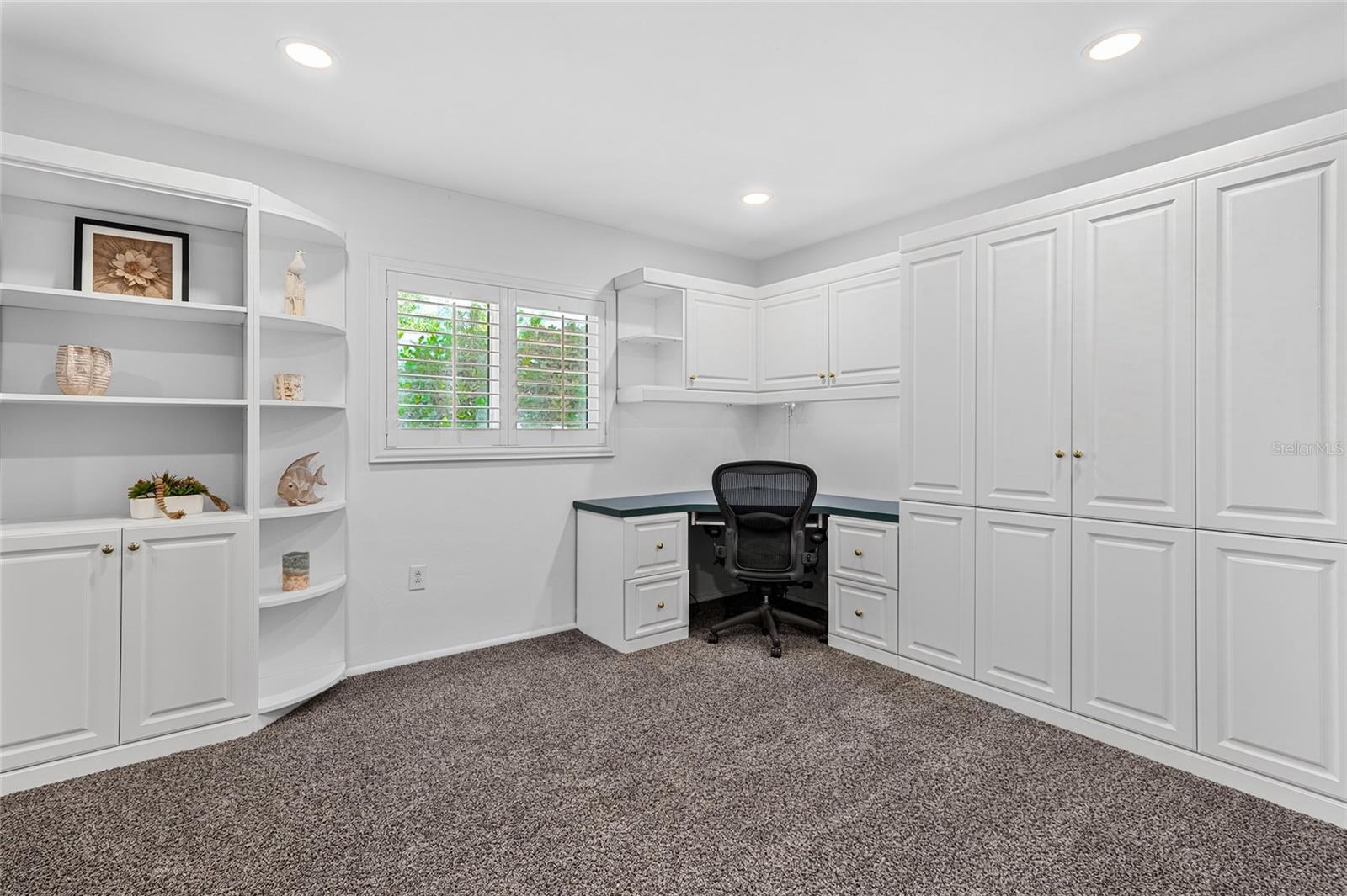 Bedroom 4 with Murphy Bed and Home Office Built Ins.