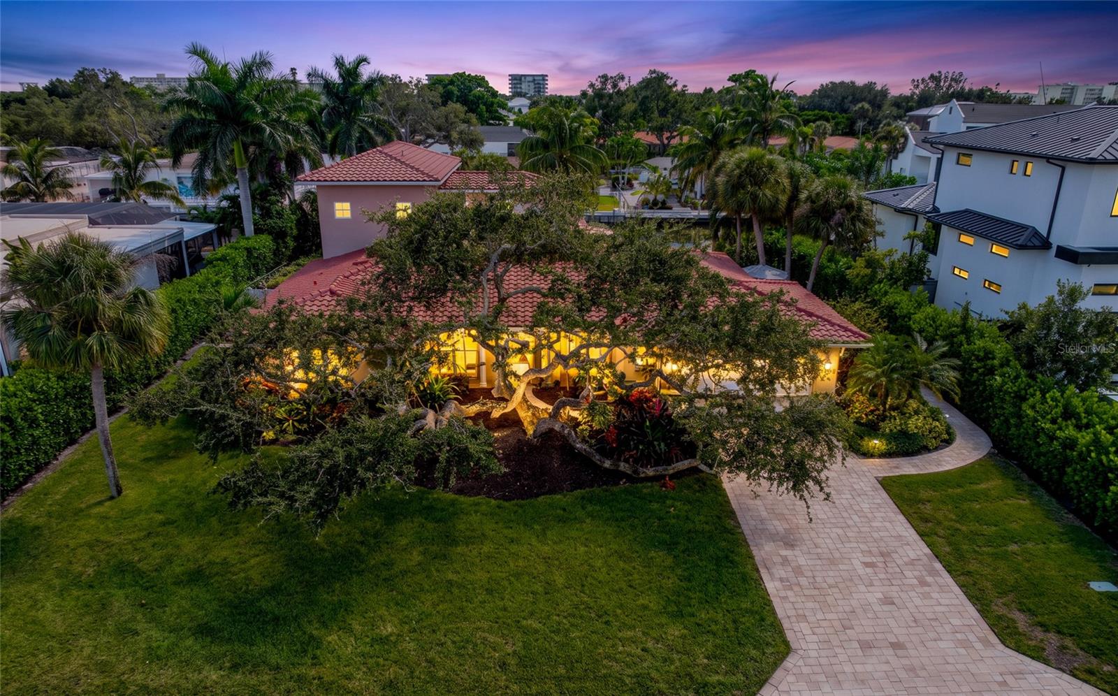 Front Aerial Twilight, providing a broader perspective of the property and its Siesta Key setting.