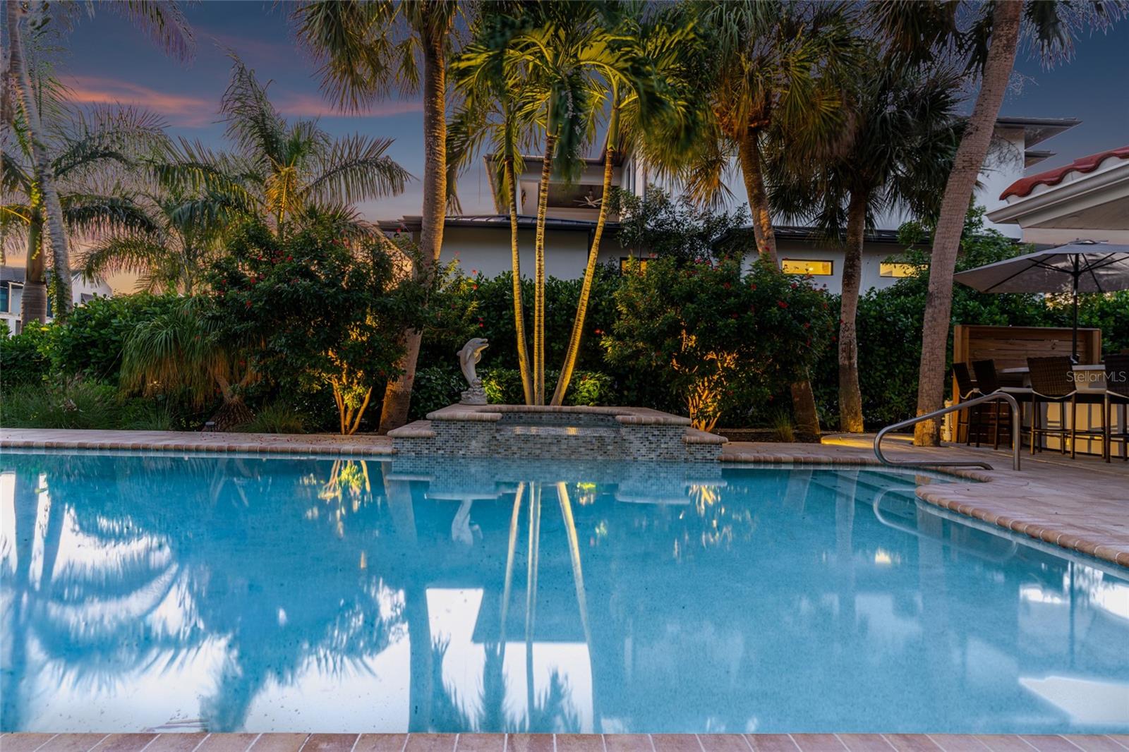 Pool Twilight Reflection, creating an inviting setting for relaxing and entertaining.