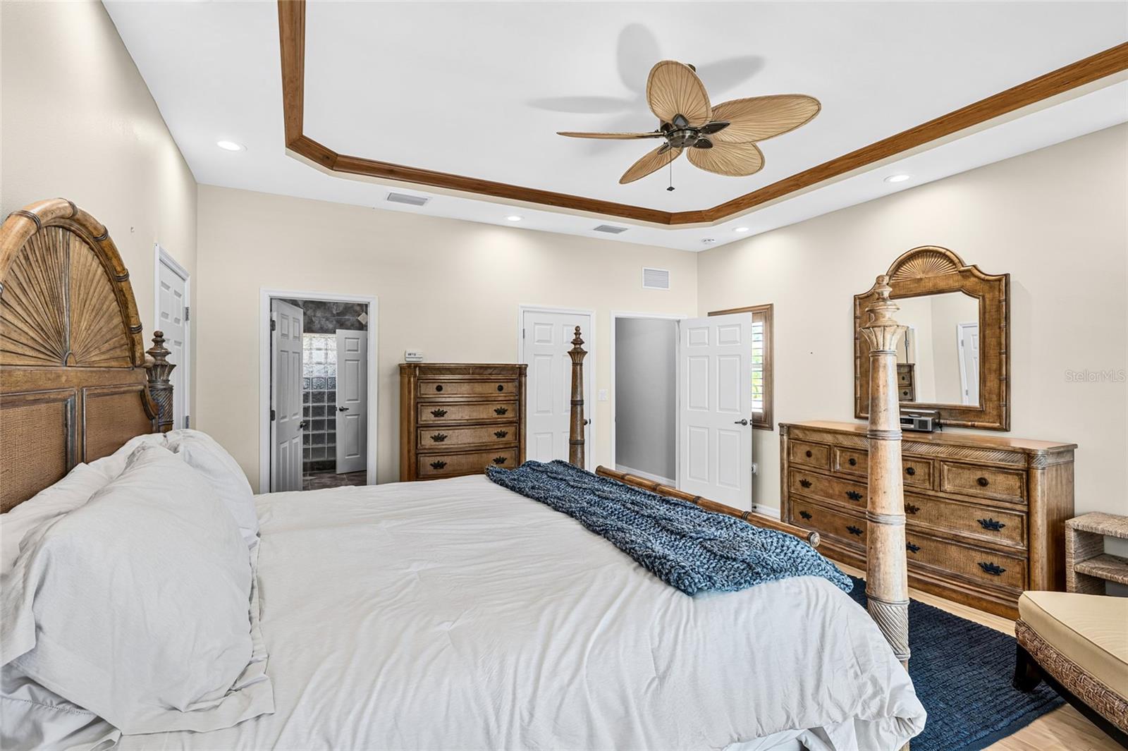 Another view of the second floor primary retreat highlights its spacious layout and peaceful private setting.