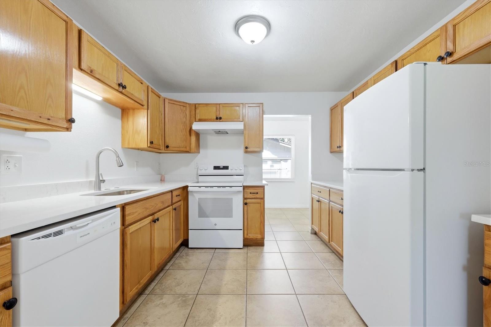 New dishwasher, range, sink and faucet.