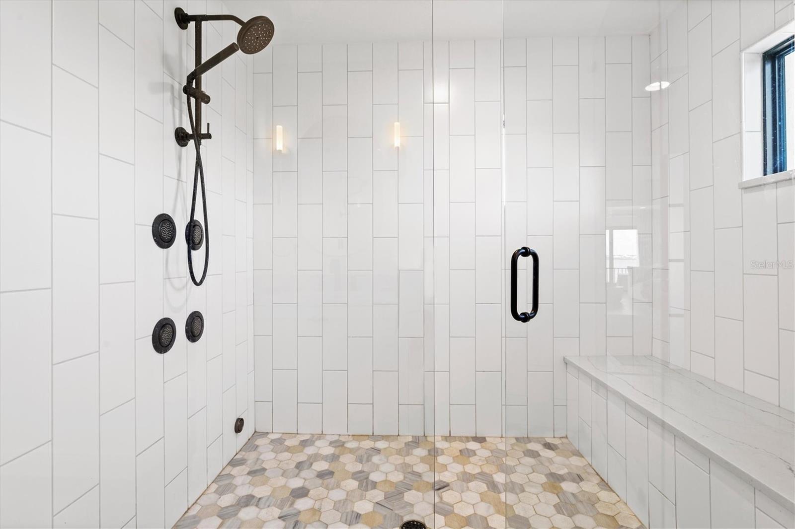 Primary suite bath with steam shower.