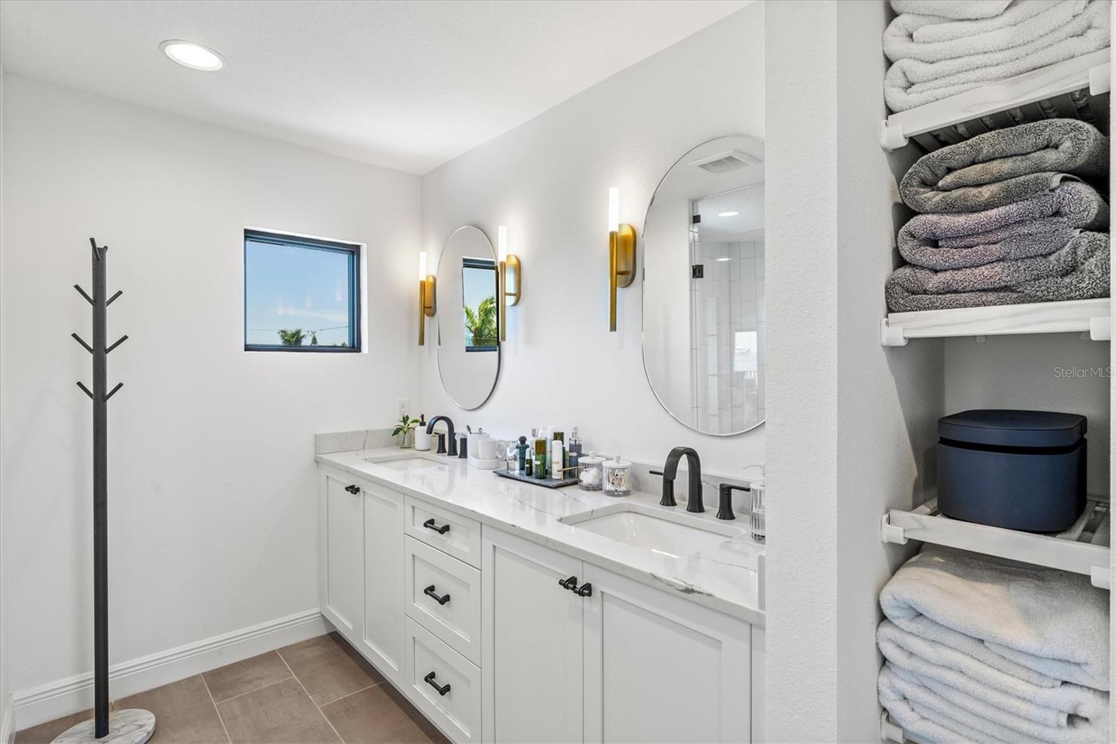Primary suite bath with dual sinks.