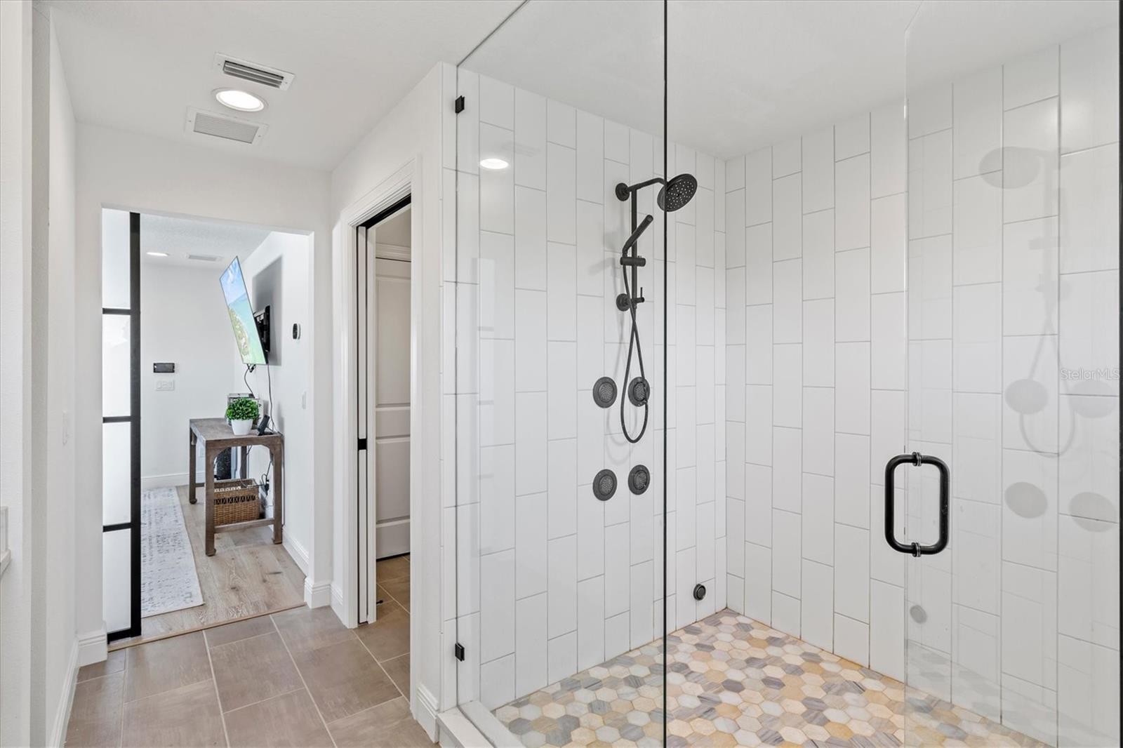 Primary suite bath with steam shower.