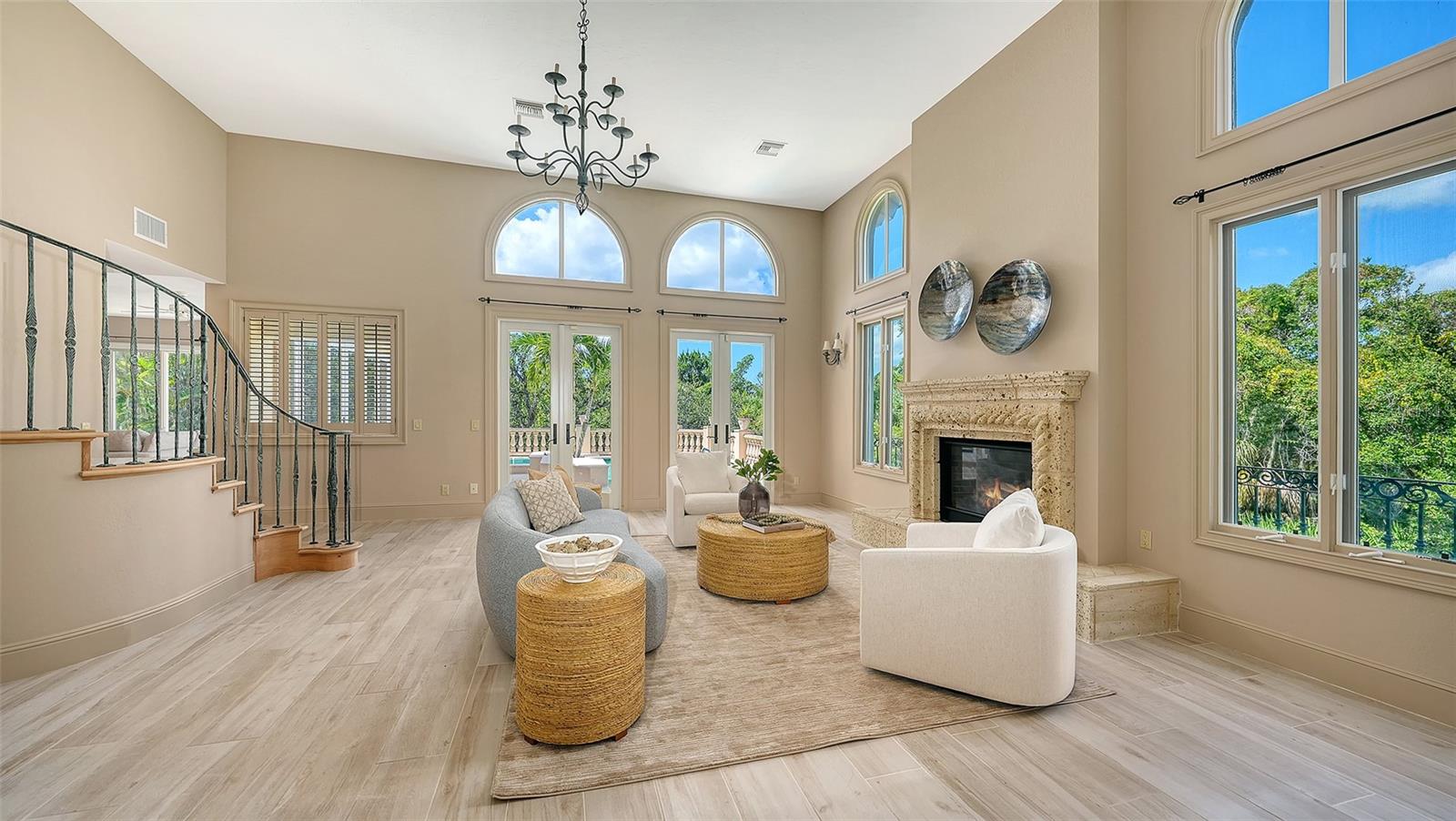Dramatic 14 foot vaulted ceilings, arched windows and abundant natural light define the elegant main living space.