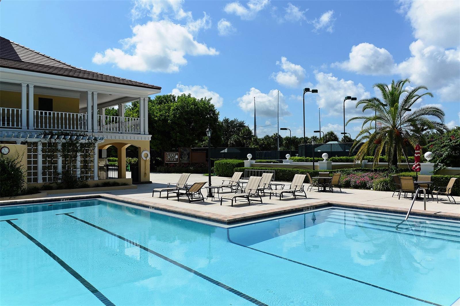 A beautifully maintained club pool provides another inviting option for leisure and recreation.