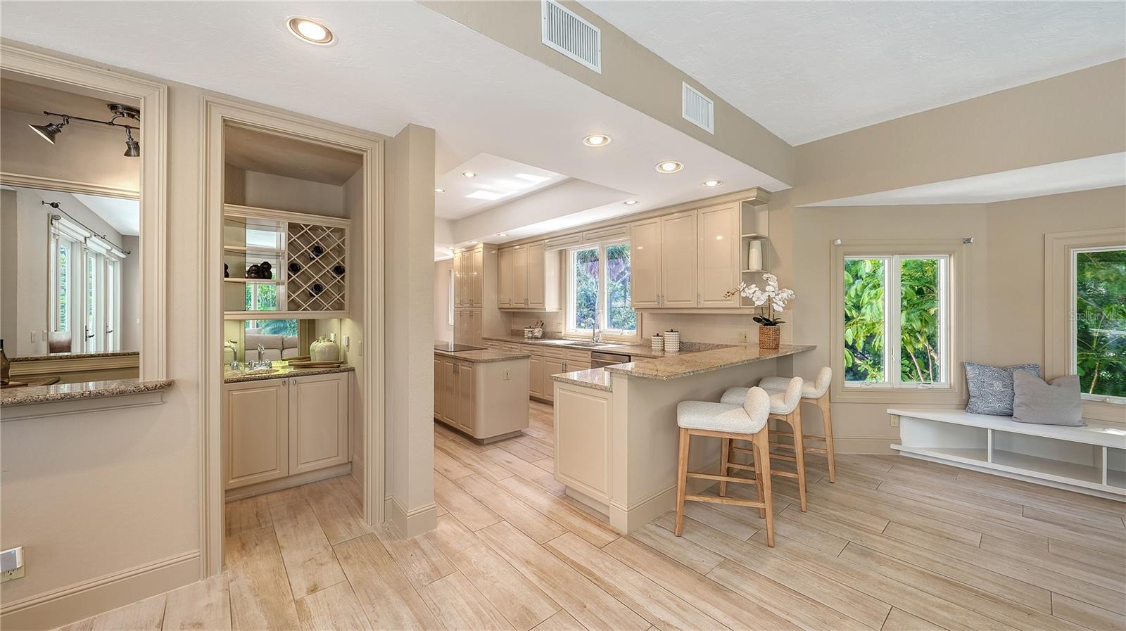 The kitchen opens naturally to the surrounding living spaces, creating an easy flow for everyday living and entertaining.