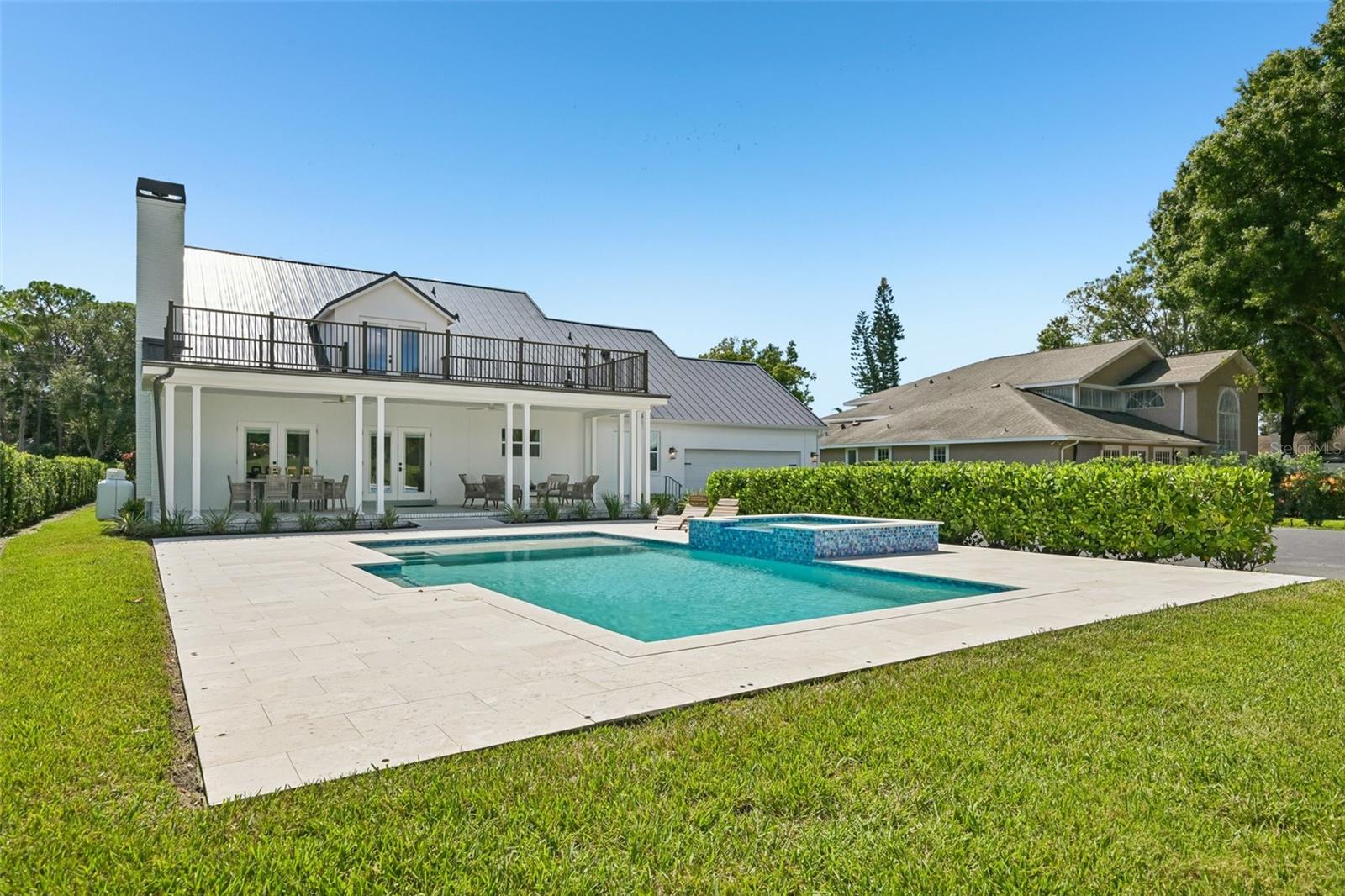 This home features a large, heated saltwater pool and spa.