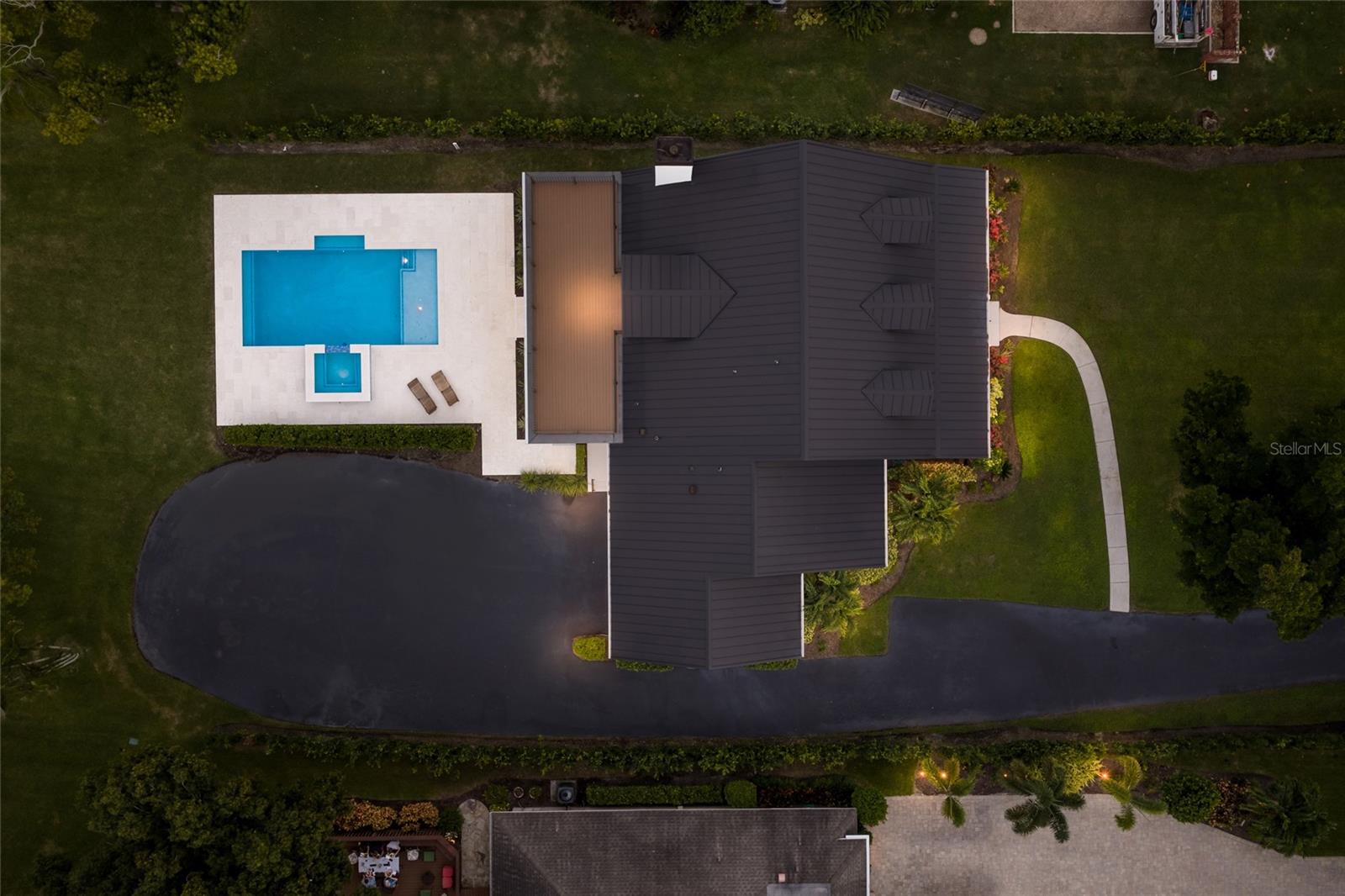 Aerial view of home and pool.
