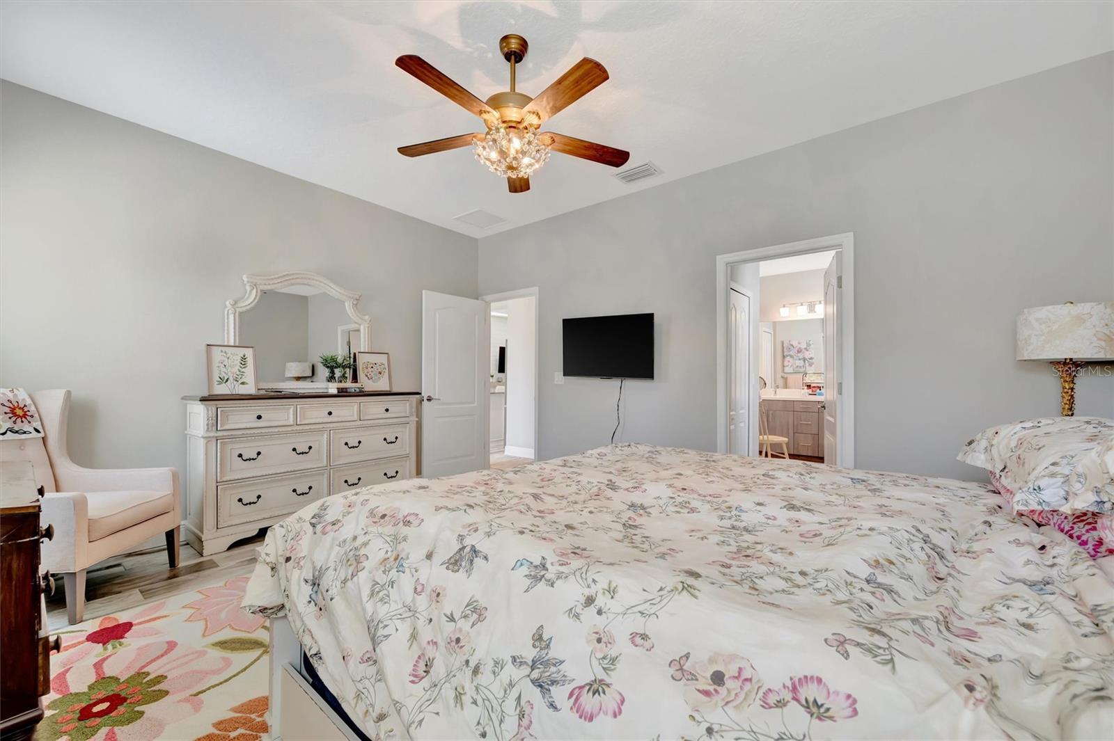 Primary bedroom with two walk-in closets