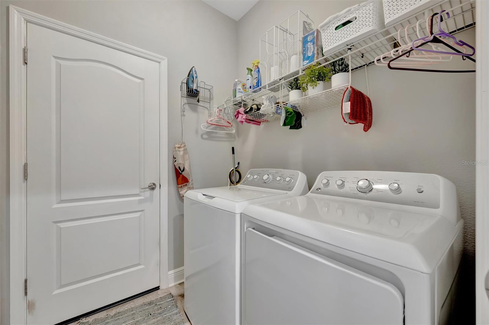 Separate laundry room leads to garage