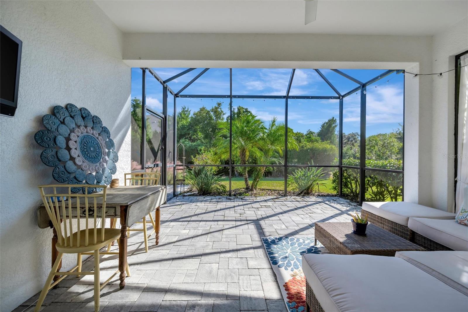 Expanded, pavered lanai awaits your quiet evenings