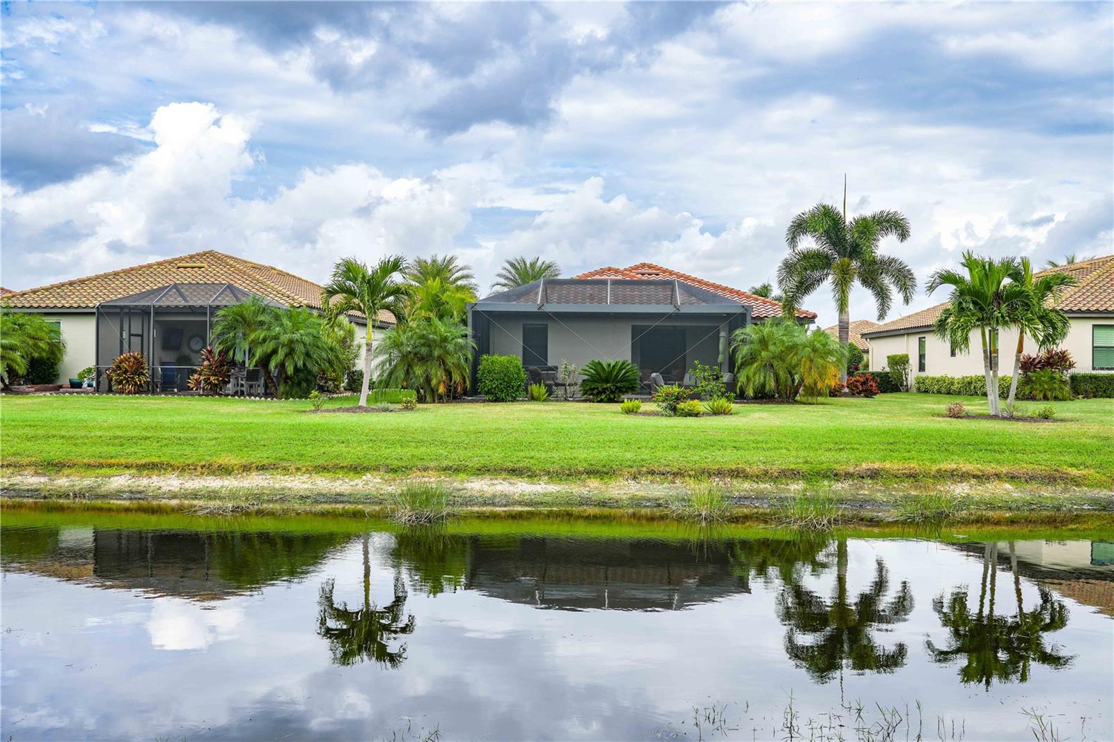 Back of house facing north from accross the pond