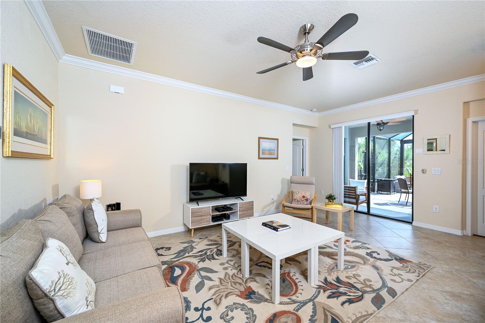 Great Room, access to lanai, primary bedroom on left