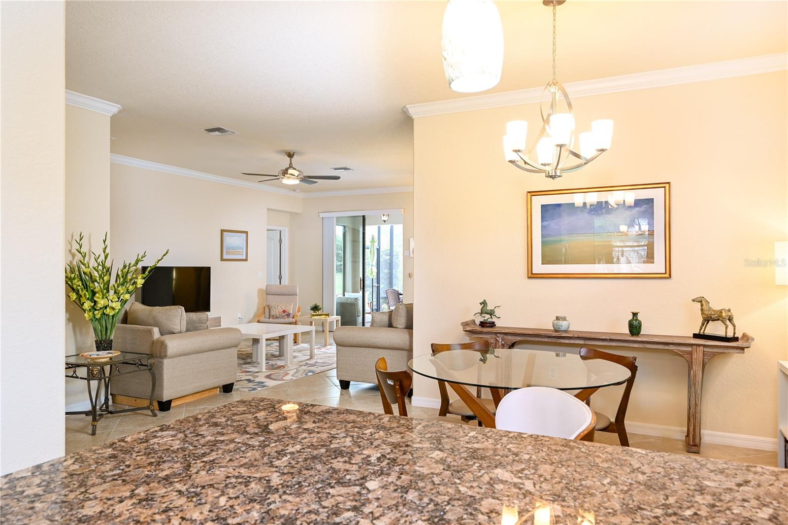 View of Great Room and lanai acces from Kitchen and dining area